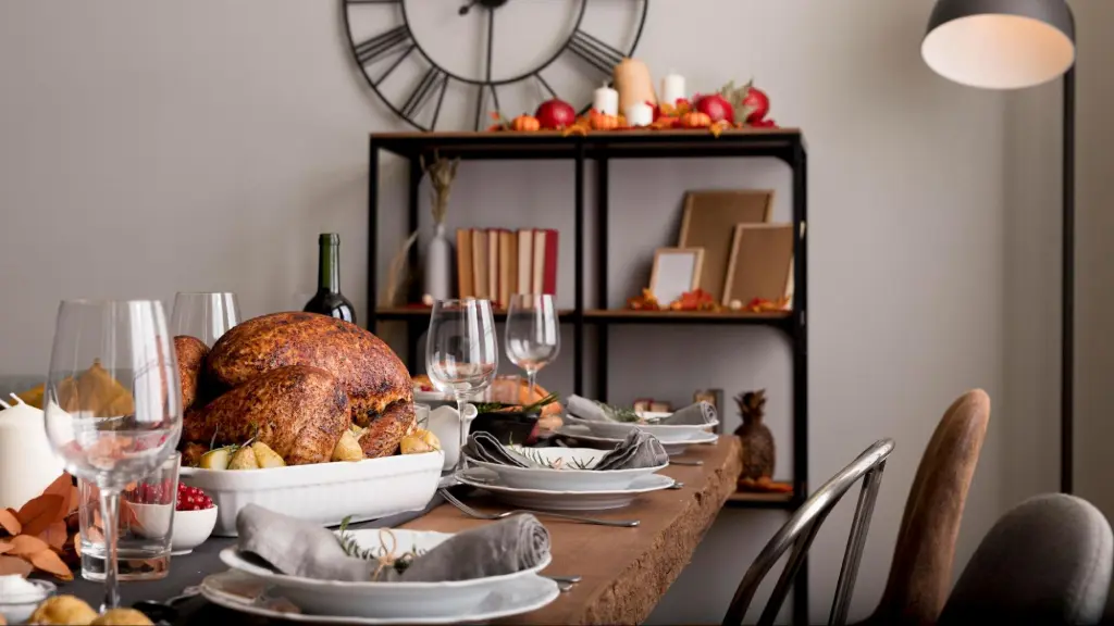 Thanksgiving dining table filled with various dishes and festive decor